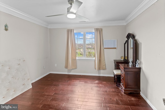 interior space with baseboards, dark wood-style flooring, and crown molding