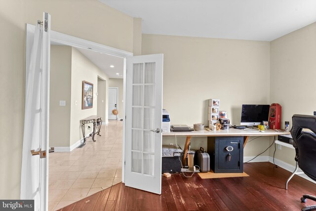 office space with recessed lighting, wood finished floors, french doors, and baseboards
