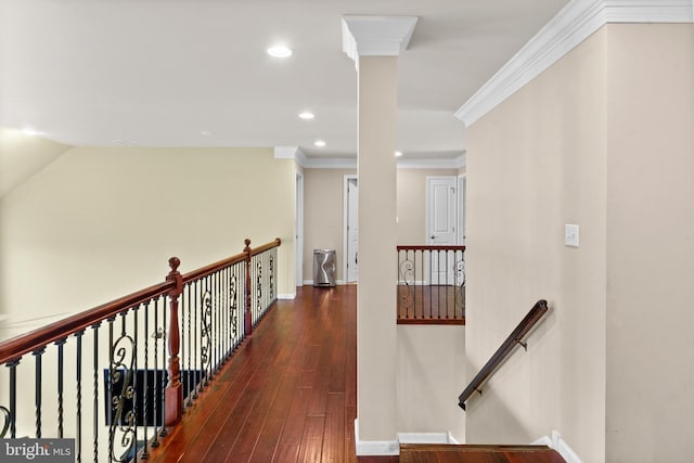 hallway with recessed lighting, an upstairs landing, crown molding, baseboards, and hardwood / wood-style floors