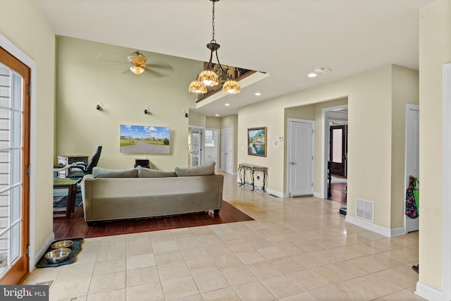 interior space with visible vents and a ceiling fan