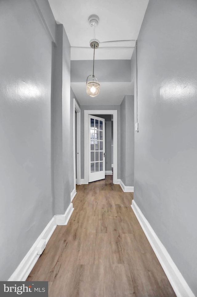 101 W 39th St Unit 101, Baltimore, MD 21210 - hallway featuring baseboards and wood finished floors