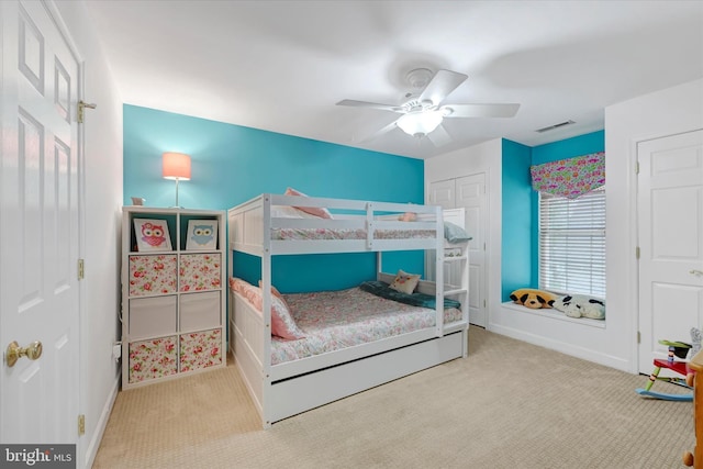 bedroom featuring baseboards, visible vents, ceiling fan, and carpet flooring