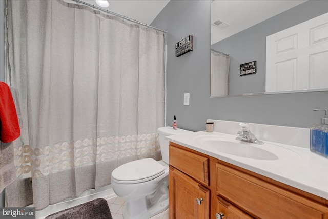 bathroom featuring tile patterned floors, toilet, vanity, visible vents, and shower / tub combo