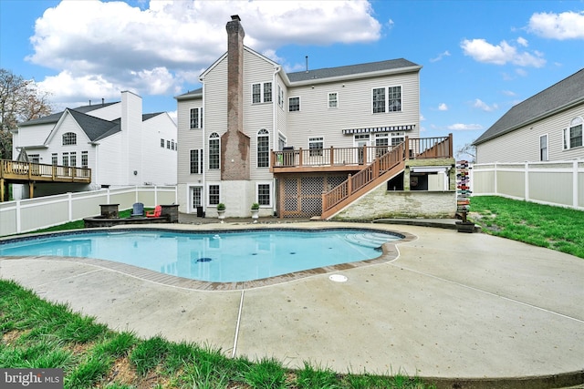 view of swimming pool with a fenced in pool, a deck, a patio area, stairway, and a fenced backyard