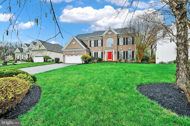 colonial house with a garage, brick siding, a front lawn, and concrete driveway
