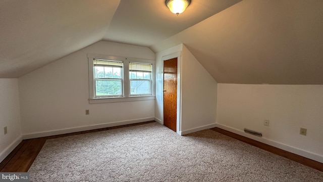 bonus room with visible vents, vaulted ceiling, carpet floors, and baseboards