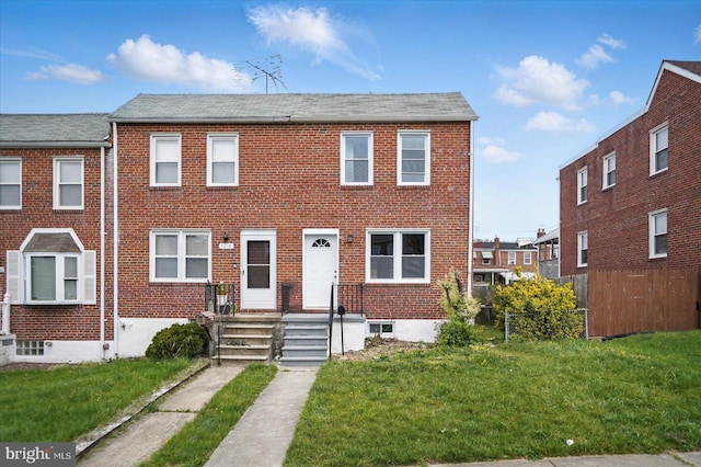 1212 Primrose Ave, Baltimore, MD 21237 - multi unit property with brick siding, fence, and a front lawn