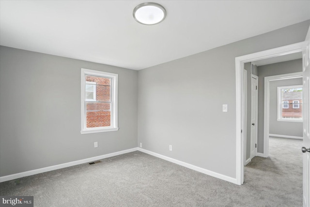 1212 Primrose Ave, Baltimore, MD 21237 - carpeted empty room featuring visible vents and baseboards