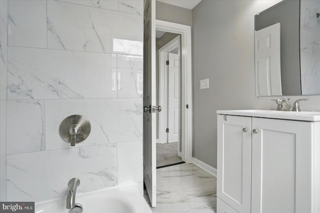 1212 Primrose Ave, Baltimore, MD 21237 - bathroom featuring marble finish floor, a bathtub, vanity, baseboards, and a shower