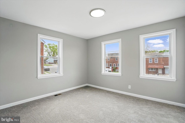 1212 Primrose Ave, Baltimore, MD 21237 - carpeted spare room featuring baseboards and visible vents