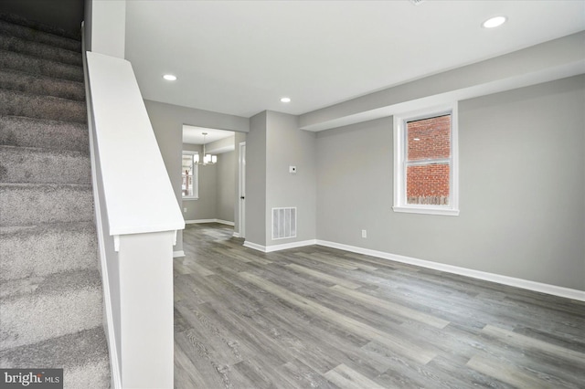 1212 Primrose Ave, Baltimore, MD 21237 - basement with visible vents, baseboards, recessed lighting, wood finished floors, and a notable chandelier