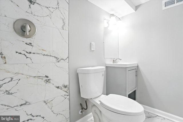 1212 Primrose Ave, Baltimore, MD 21237 - full bathroom with visible vents, baseboards, toilet, vanity, and marble finish floor