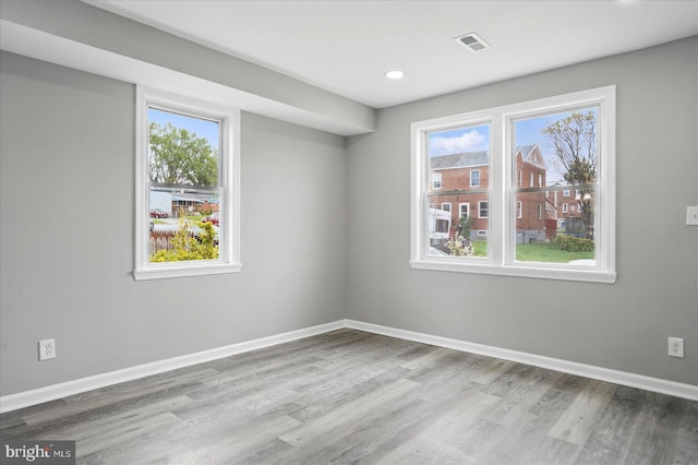 1212 Primrose Ave, Baltimore, MD 21237 - spare room featuring wood finished floors, visible vents, recessed lighting, and baseboards