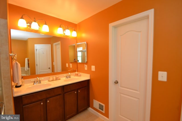 724 Hidden Oak Ln, Glen Burnie, MD 21060 - full bath featuring visible vents, a sink, tile patterned floors, and double vanity