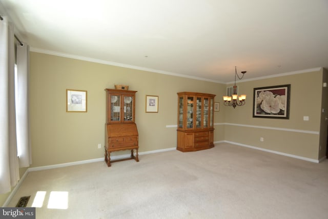 724 Hidden Oak Ln, Glen Burnie, MD 21060 - spare room featuring an inviting chandelier, baseboards, crown molding, and light carpet