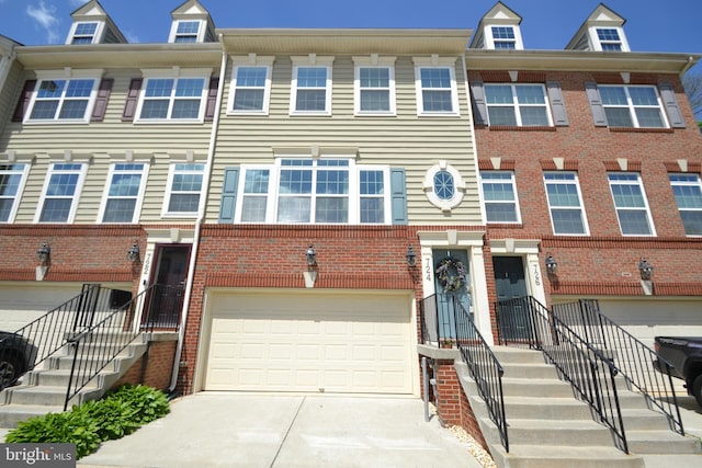 724 Hidden Oak Ln, Glen Burnie, MD 21060 - multi unit property with a garage, driveway, and brick siding