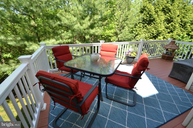724 Hidden Oak Ln, Glen Burnie, MD 21060 - wooden deck with outdoor dining space and a wooded view