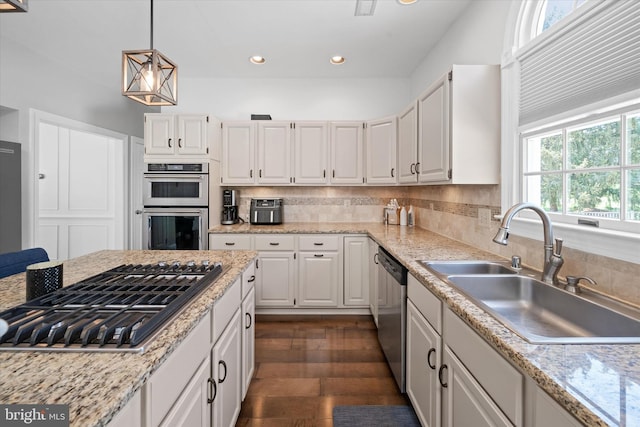 kitchen featuring a sink, white cabinetry, and stainless steel appliances