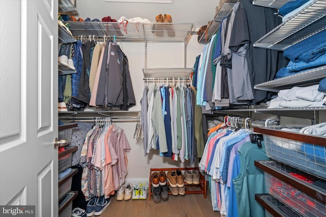 spacious closet with wood finished floors