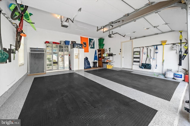 garage featuring a garage door opener
