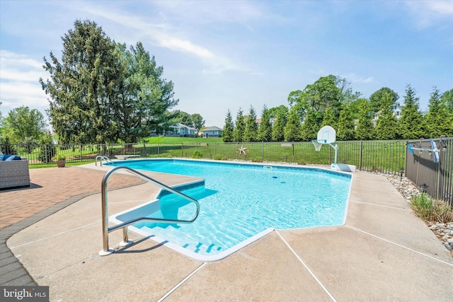 view of swimming pool featuring a fenced in pool, a patio area, and fence