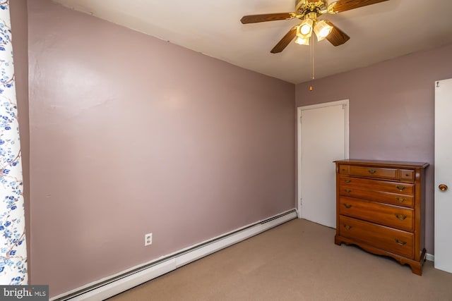 bedroom featuring ceiling fan, a baseboard heating unit, and light carpet