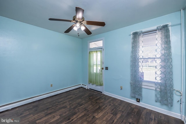 empty room featuring baseboards, a baseboard radiator, dark wood-style flooring, and a ceiling fan