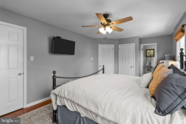 bedroom featuring baseboards, a ceiling fan, and wood finished floors