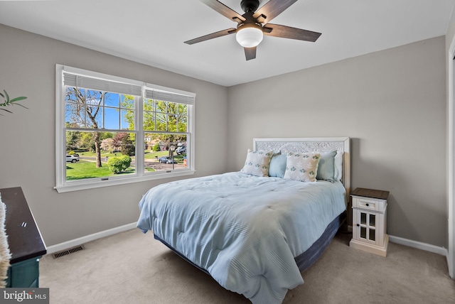 bedroom with visible vents, carpet flooring, and baseboards