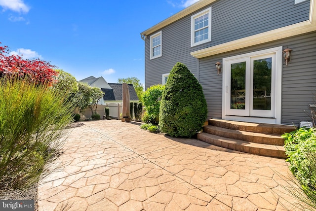 view of patio featuring fence and entry steps