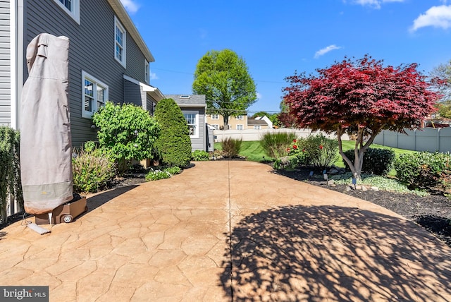 view of patio featuring fence