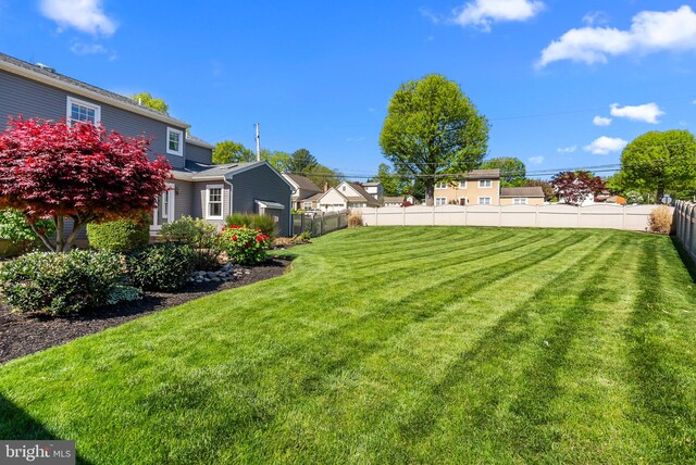 view of yard featuring fence
