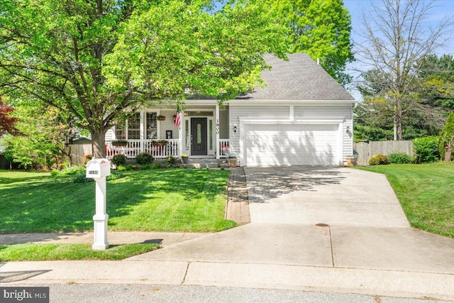 obstructed view of property with a garage, a front yard, covered porch, and driveway