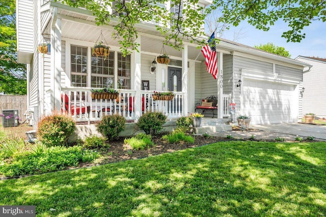 ranch-style home featuring a porch, driveway, central air condition unit, a front lawn, and an attached garage