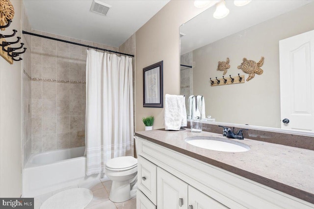 bathroom featuring visible vents, tile patterned floors, vanity, toilet, and shower / bath combo with shower curtain