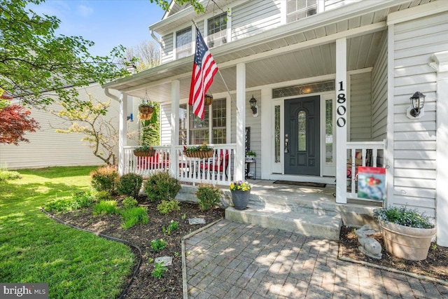 doorway to property with covered porch