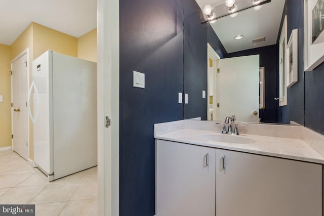 bathroom featuring visible vents, tile patterned flooring, and vanity