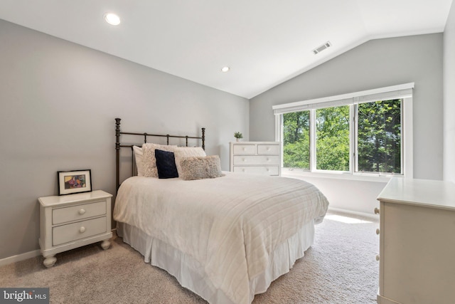 bedroom featuring baseboards, light carpet, recessed lighting, and lofted ceiling