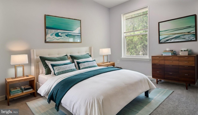 bedroom with carpet and baseboards