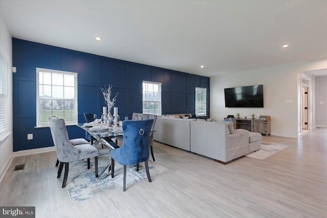 5735 River Shark Ln, Waldorf, MD 20602 - dining area with a decorative wall, light wood finished floors, recessed lighting, and baseboards