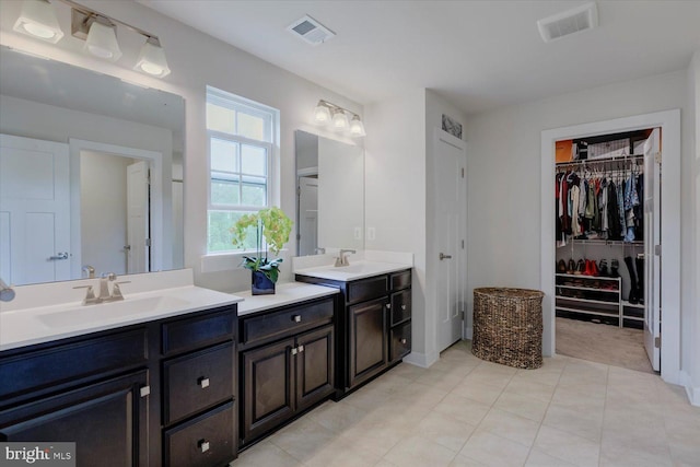 5735 River Shark Ln, Waldorf, MD 20602 - full bath with double vanity, a spacious closet, and tile patterned floors