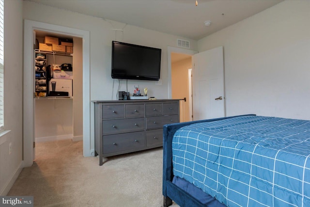 5735 River Shark Ln, Waldorf, MD 20602 - bedroom with light carpet, a spacious closet, and baseboards