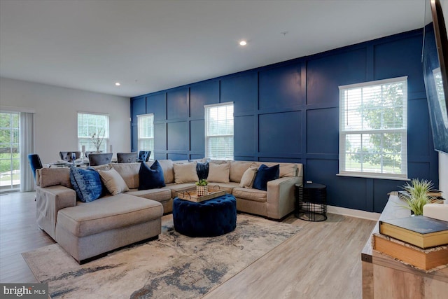 5735 River Shark Ln, Waldorf, MD 20602 - living room with a decorative wall, wood finished floors, and recessed lighting