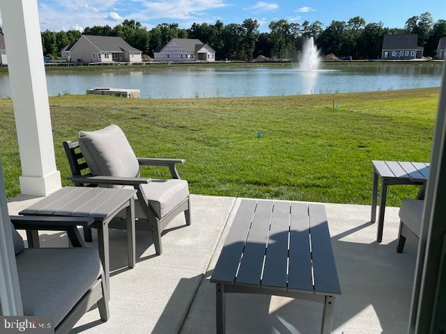 view of patio with a water view