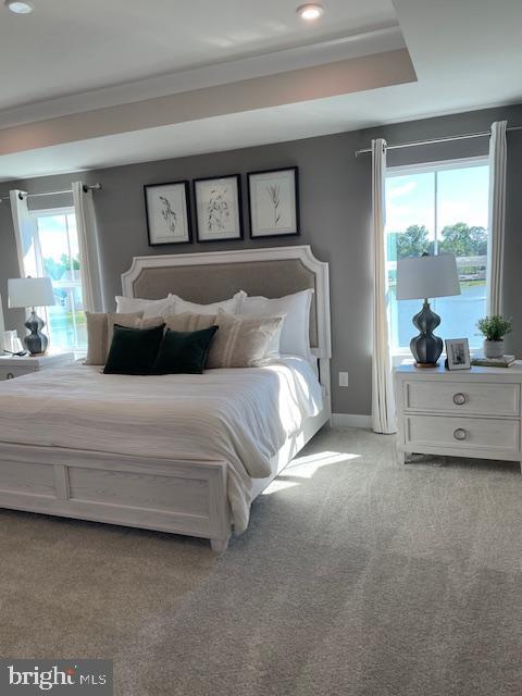 bedroom with baseboards, recessed lighting, and light colored carpet