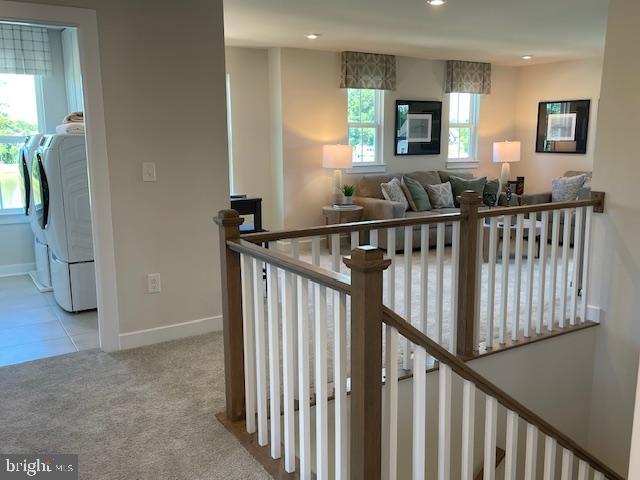 interior space with recessed lighting, baseboards, carpet, and a healthy amount of sunlight
