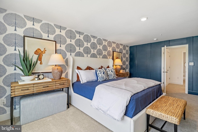 carpeted bedroom with wallpapered walls