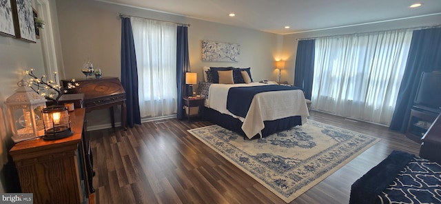 bedroom with recessed lighting and wood finished floors