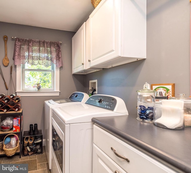 laundry room with cabinet space and washing machine and clothes dryer