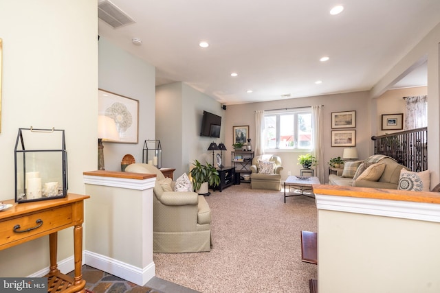 living area featuring carpet floors, recessed lighting, baseboards, and visible vents